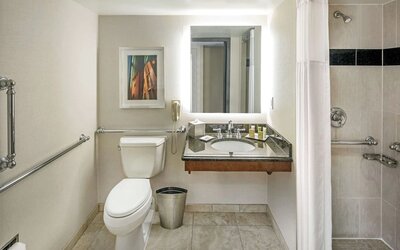 Private guest bathroom with shower and free toiletries at Hilton Minneapolis.