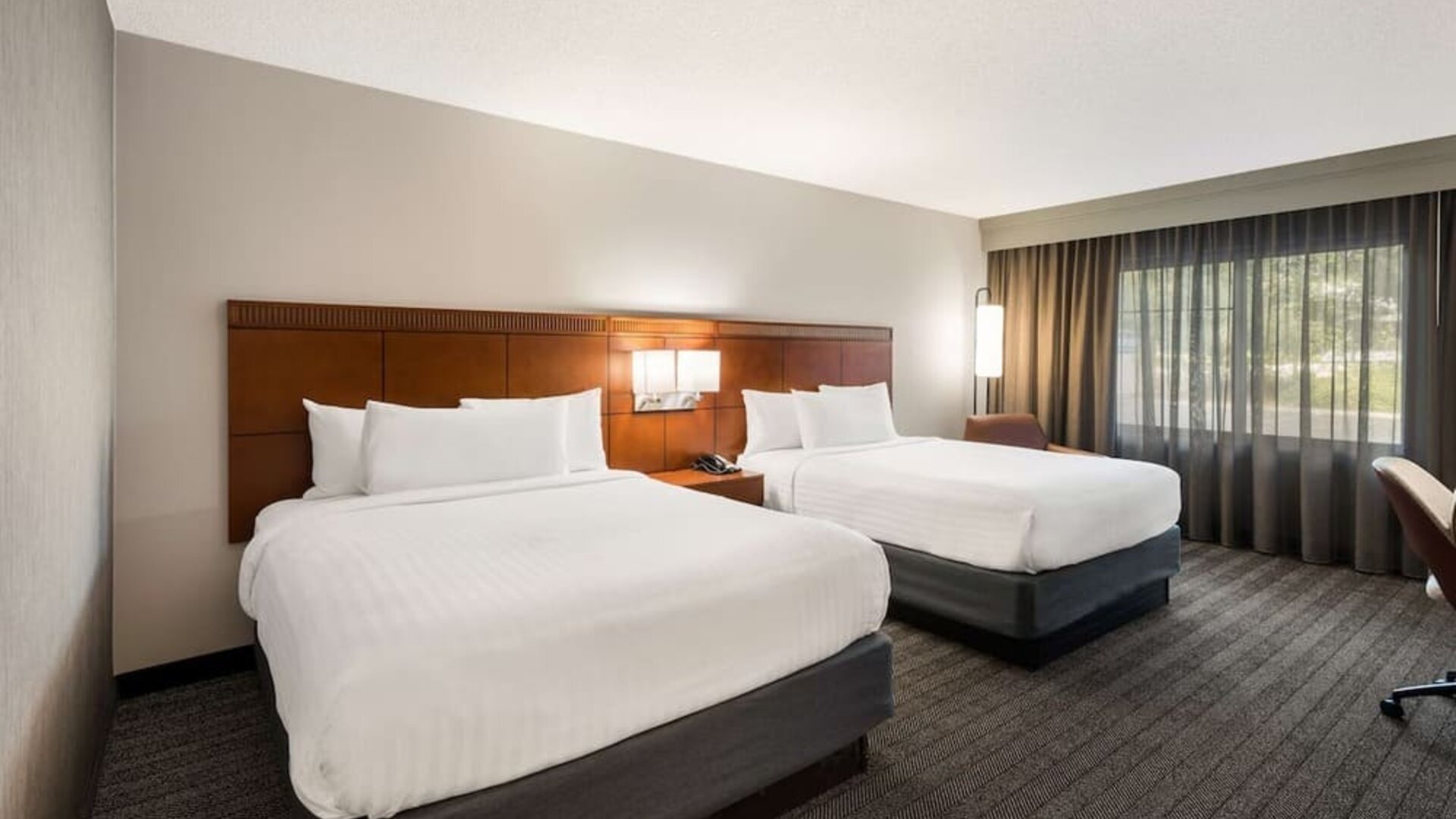 Bright and spacious day use twin room with work desk at Sonesta Select San Jose Airport.