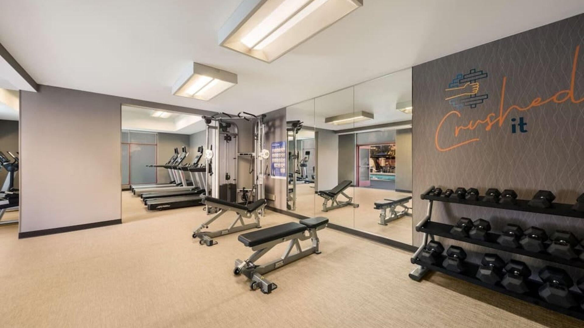 Fully equipped fitness center at Sonesta Select San Jose Airport.
