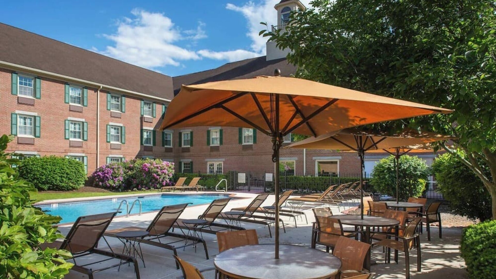 Outdoor pool and lounge area at Sonesta Select Boston Lowell Chelmsford.