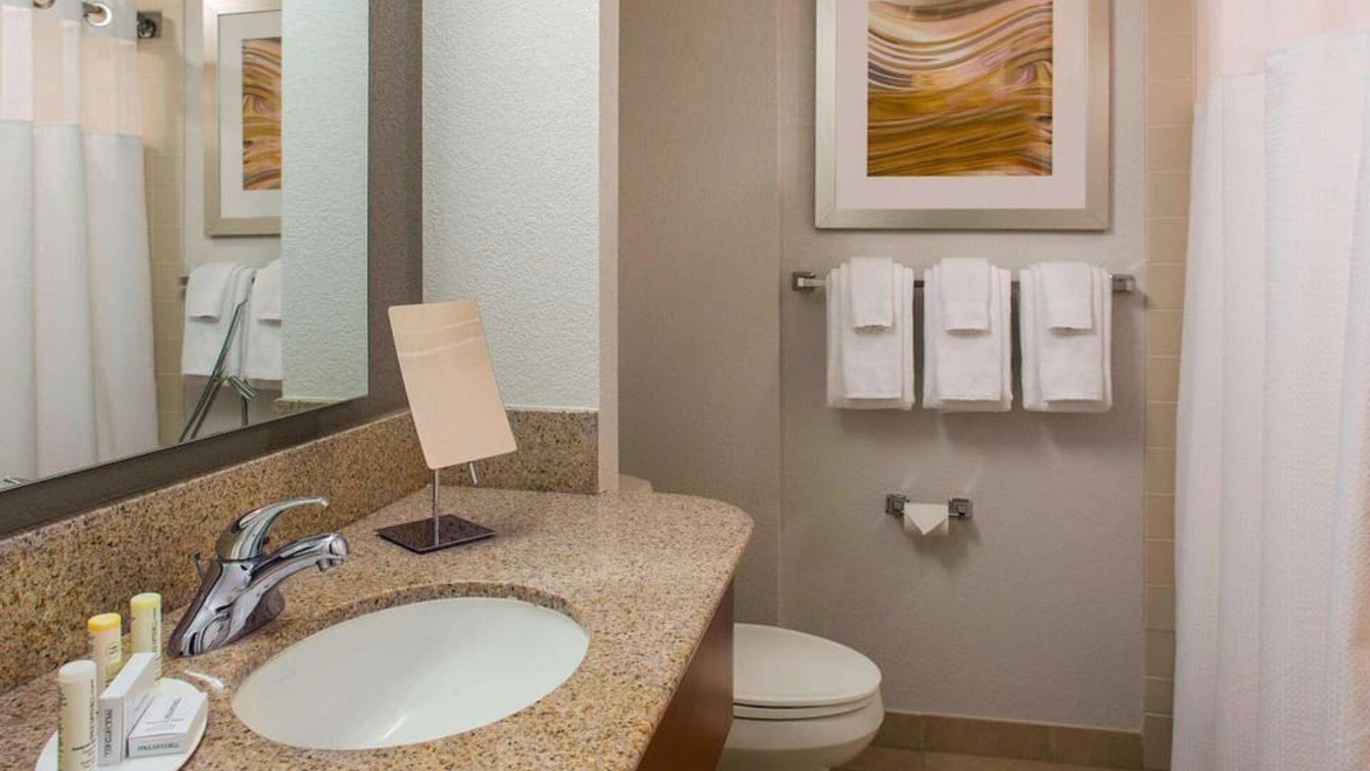 Private guest bathroom with shower and free toiletries at Sonesta Select Boston Lowell Chelmsford.