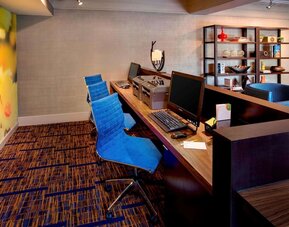 Business center with computers, printer and ergonomic chairs at Sonesta Select Boston Danvers.