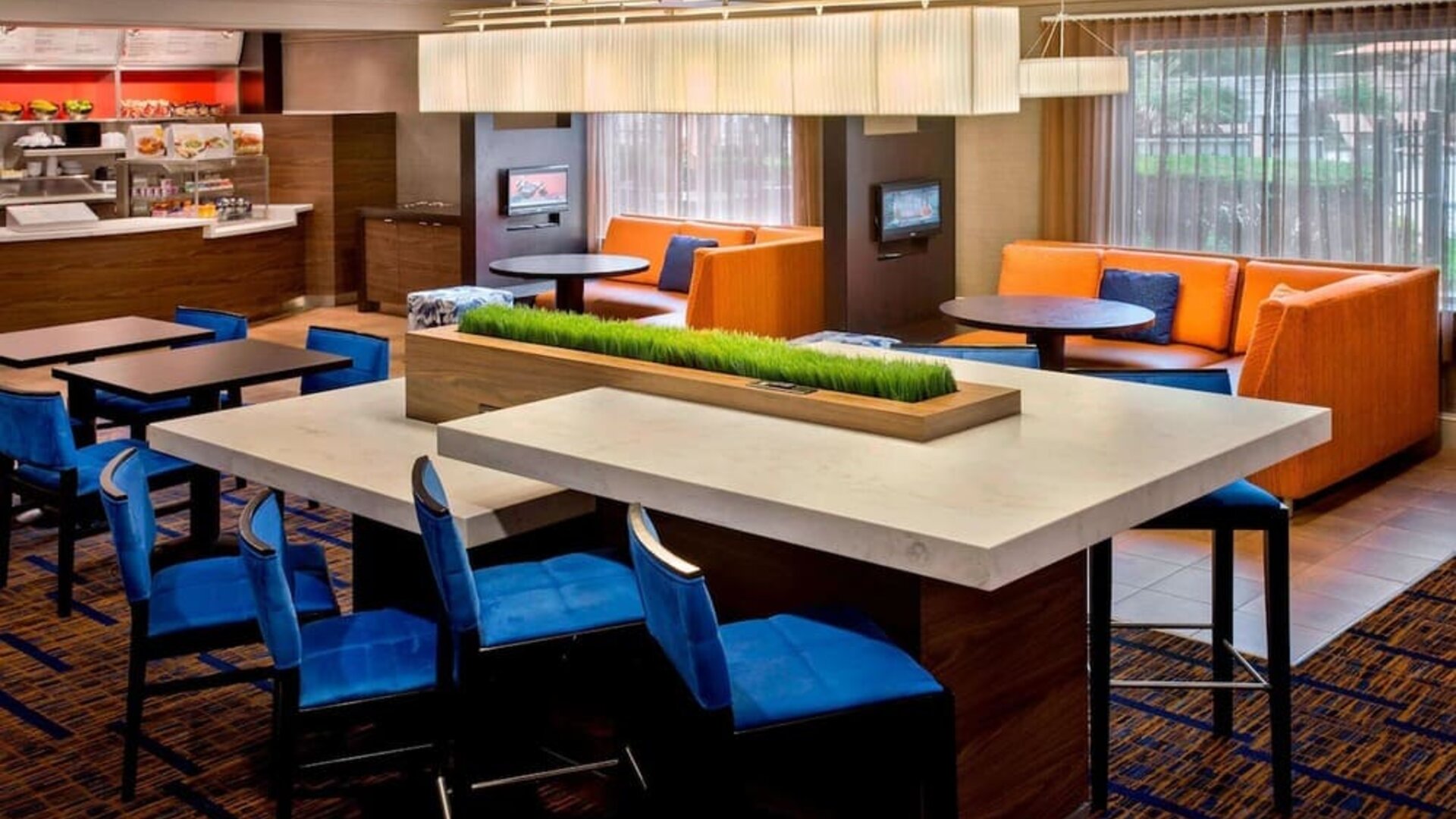 Dining area and workspace at Sonesta Select Boston Danvers.