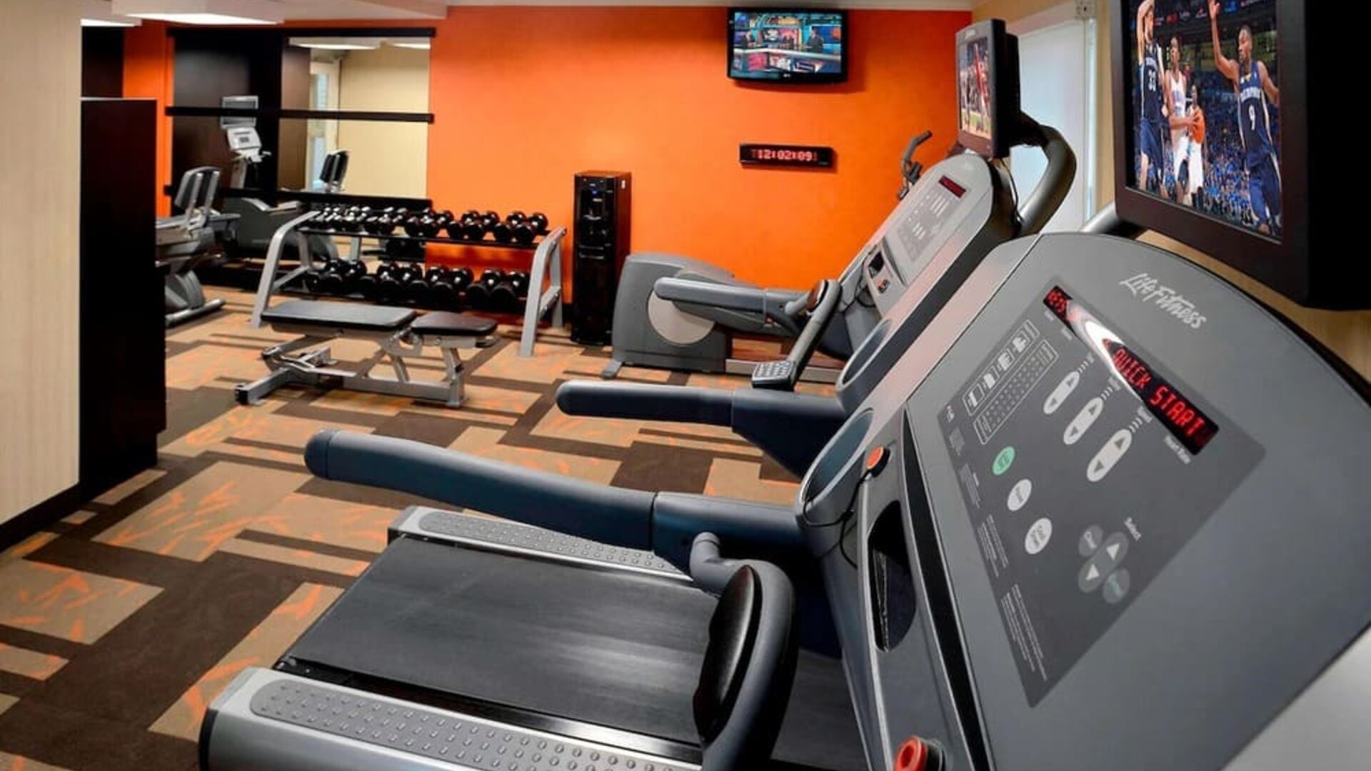 Fully equipped fitness center at Sonesta Select Boston Danvers.