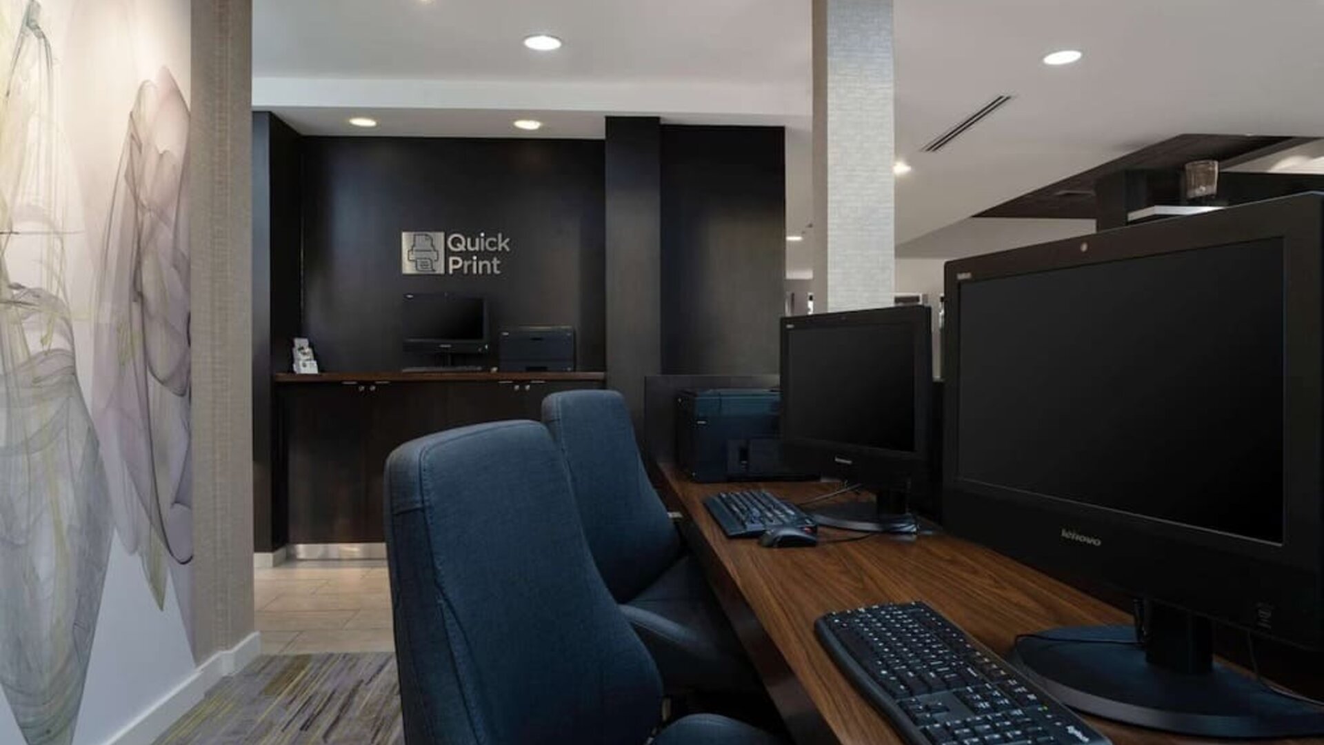 Business center with computers, printer and ergonomic chairs at Sonesta Select Chattanooga Hamilton Place.