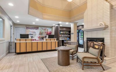 Lobby lounge with fireplace at Sonesta ES Suites Dulles Airport.