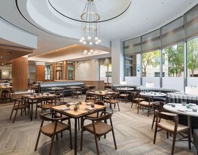 Dining area with natural light perfect for coworking at The Westin Arlington Gateway.