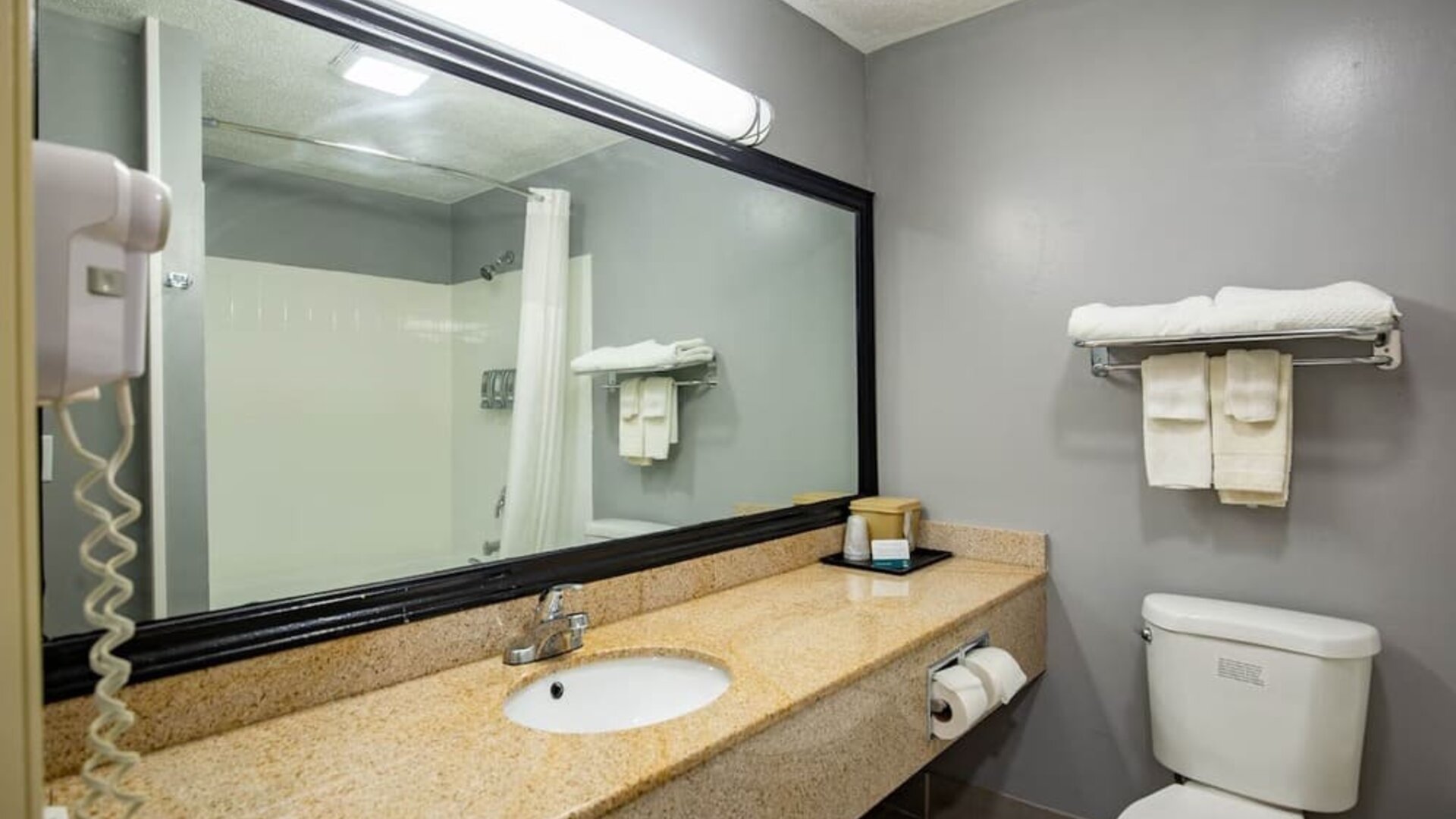 Guest bathroom at Quality Inn & Suites Woodstock Near Lake Geneva.