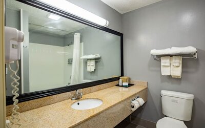 Guest bathroom at Quality Inn & Suites Woodstock Near Lake Geneva.