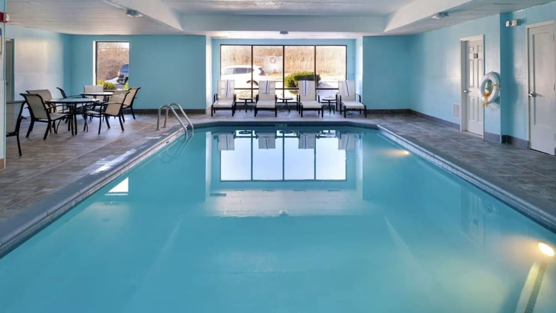 Relaxing indoor pool with lounge seating at Hampton Inn Columbus-East.