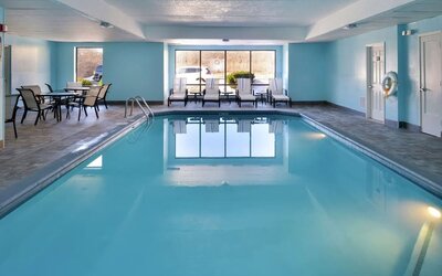 Relaxing indoor pool with lounge seating at Hampton Inn Columbus-East.