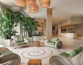 Beautiful lobby lounge at Embassy Suites By Hilton Panama City Beach Resort.