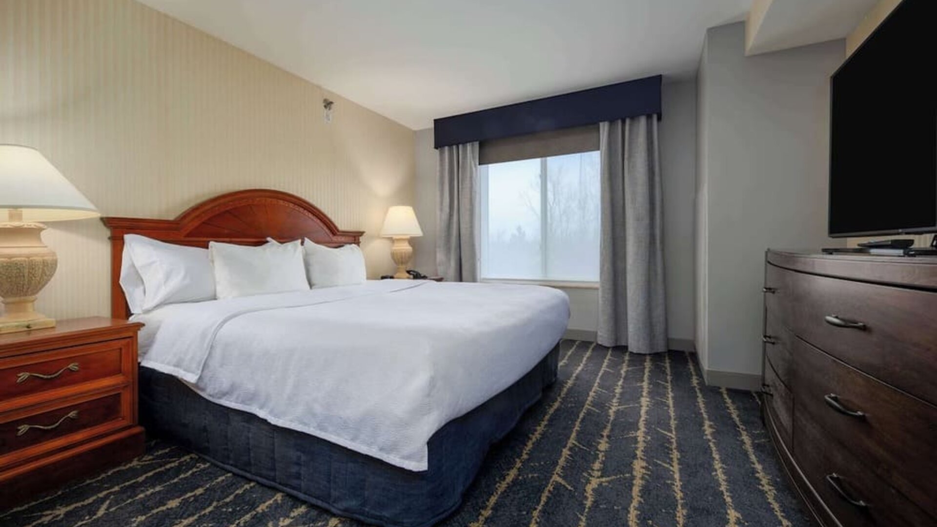 Standard day use room with TV screen and private bathroom at Hilton Garden Inn Milwaukee Northwest Conference Center.