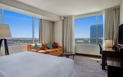 Day use room with work desk and a view of the city at Hilton Dallas/ Plano Granite Park.