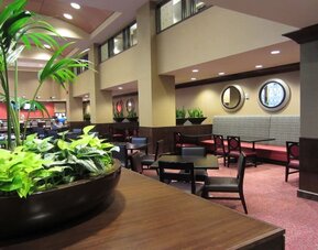 Dining area perfect for coworking at Embassy Suites By Hilton St. Louis Downtown.
