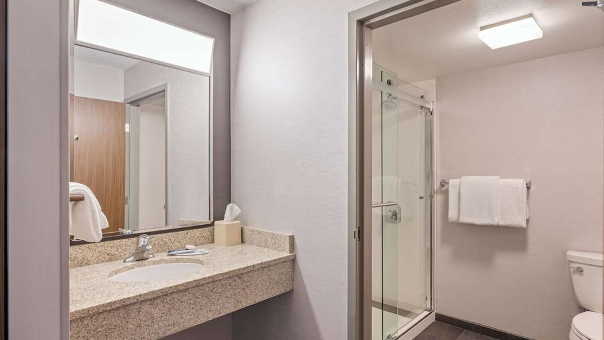 Guest bathroom with shower at Sonesta Select Phoenix Chandler.
