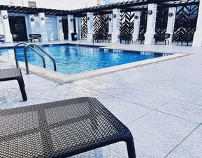 Refreshing outdoor pool at The Chifley Houston, Tapestry Collection By Hilton.
