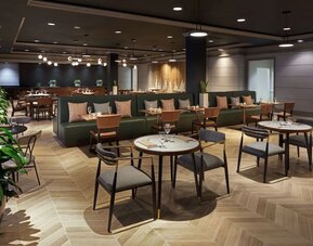 Dining area perfect for coworking at The Chifley Houston, Tapestry Collection By Hilton.