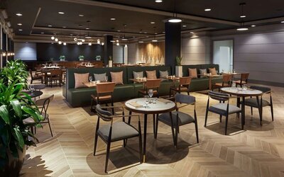 Dining area perfect for coworking at The Chifley Houston, Tapestry Collection By Hilton.