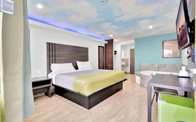 Day use room with TV at Exclusivo Inn & Suites. 