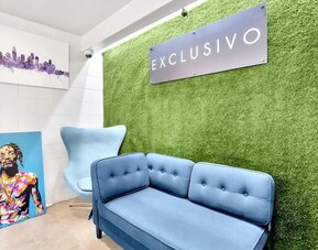 Lobby seating at Exclusivo Inn & Suites. 