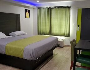 Day use room with TV at Exclusivo Inn & Suites. 