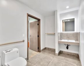 Private guest bathroom with shower at Exclusivo Inn & Suites. 