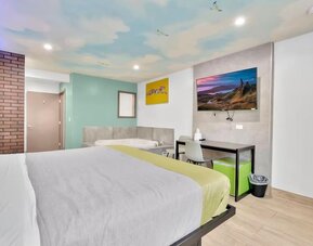 Day use room with TV at Exclusivo Inn & Suites. 