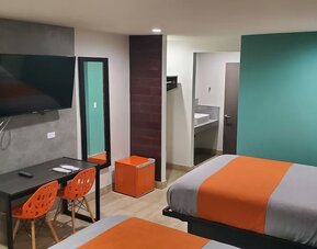 Day use room with TV at Exclusivo Inn & Suites. 