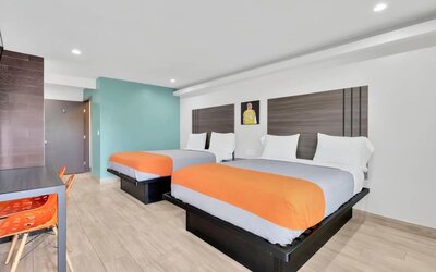 Day use room with TV at Exclusivo Inn & Suites. 