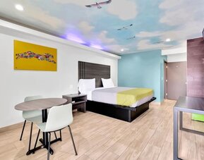 Day use room with TV at Exclusivo Inn & Suites. 