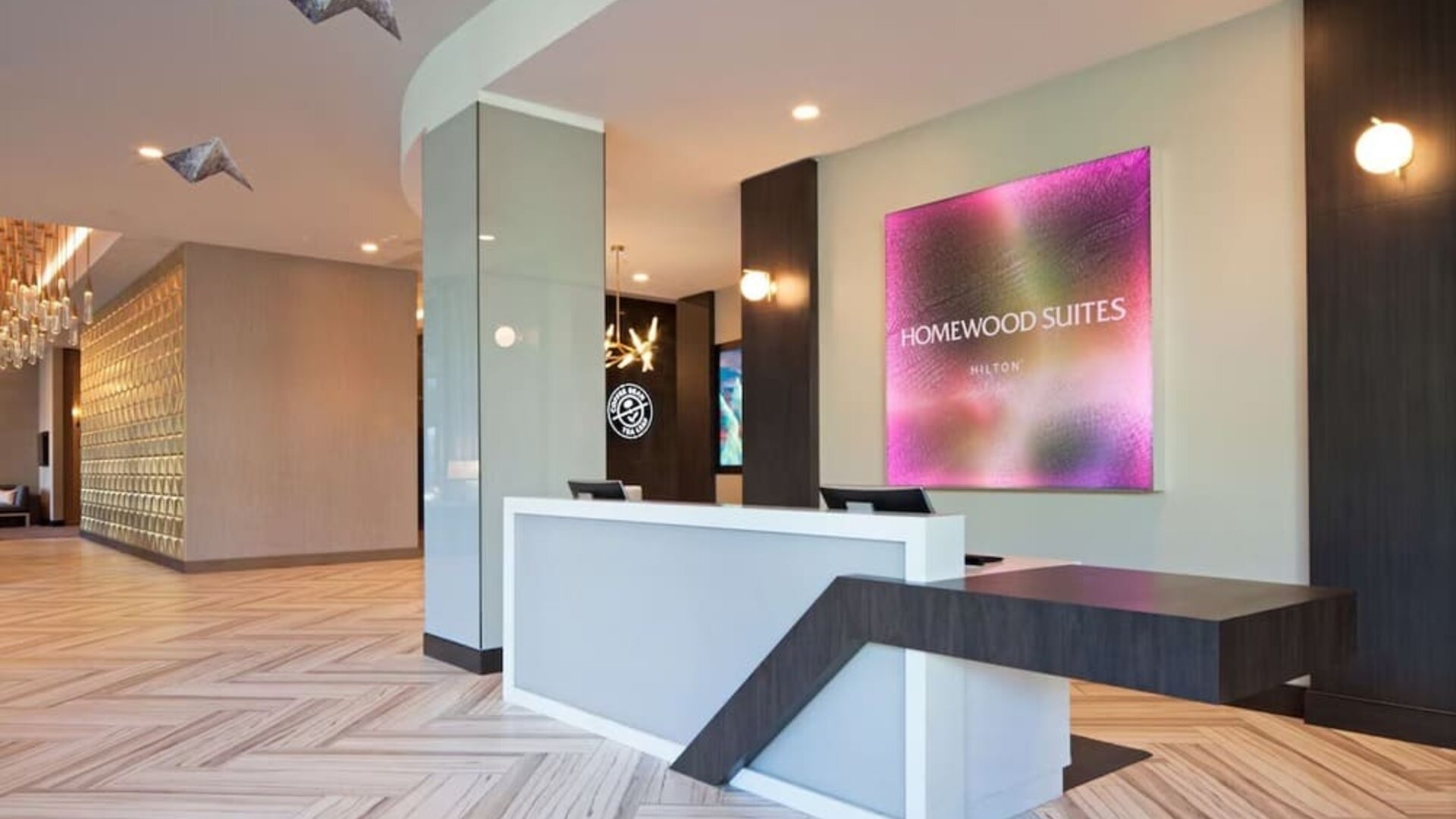 Reception desk at Homewood Suites By Hilton Los Angeles International Airport.