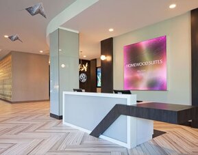 Reception desk at Homewood Suites By Hilton Los Angeles International Airport.