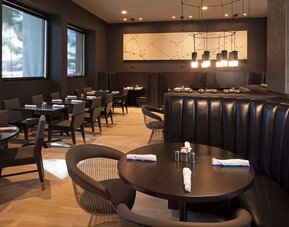 Dining area at Homewood Suites By Hilton Los Angeles International Airport.