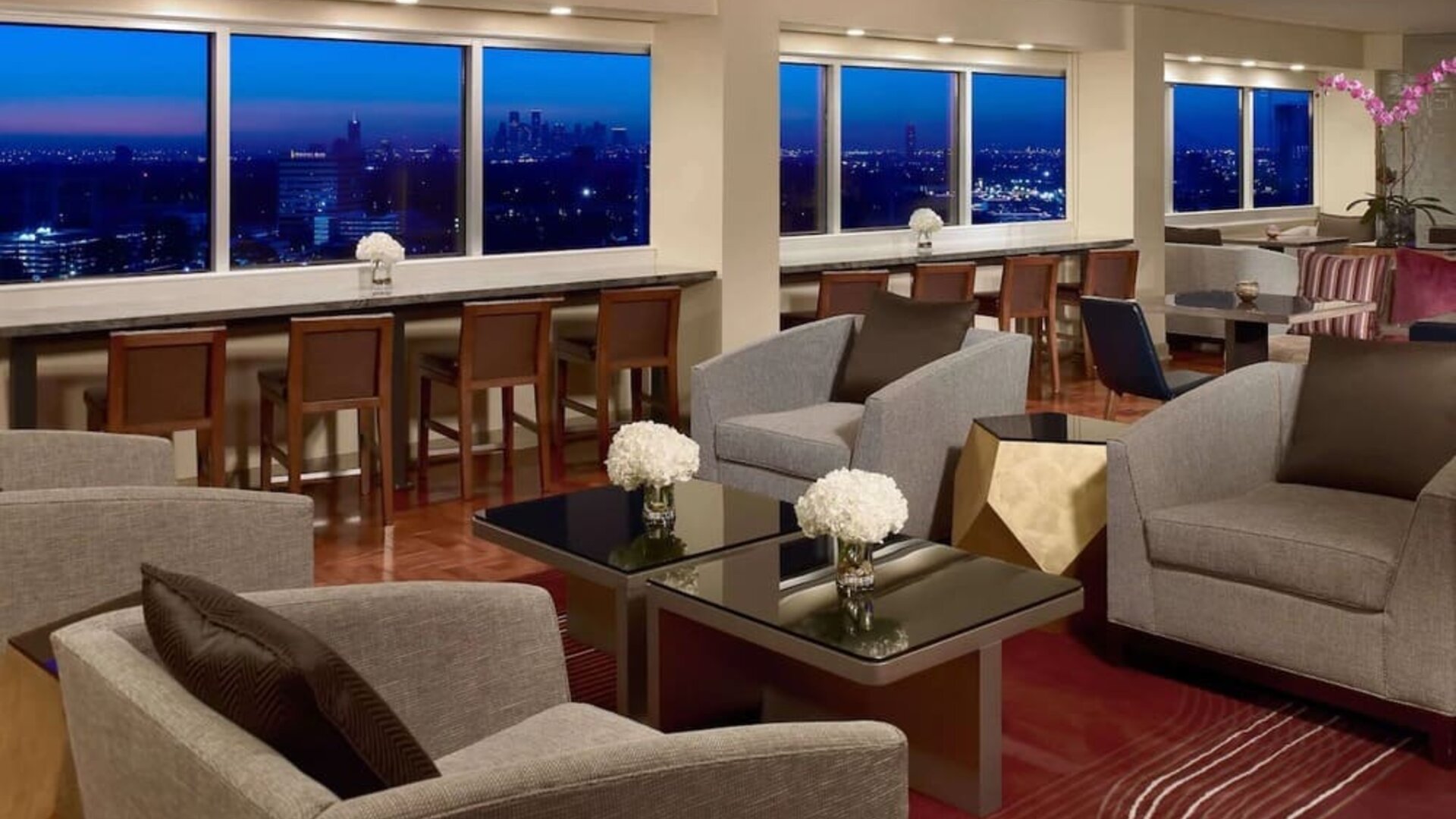 Lobby lounge area and workspace at Royal Sonesta Houston Galleria.