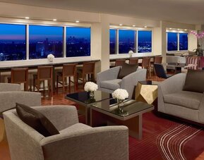 Lobby lounge area and workspace at Royal Sonesta Houston Galleria.