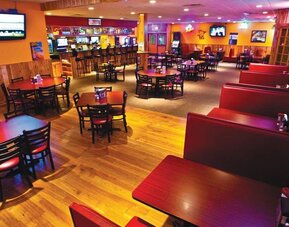 On-site bar and seating area at Norwood Inn And Suites Worthington.