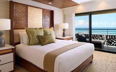 King bed at Ko'a Kea Resort On Po`ipu Beach.