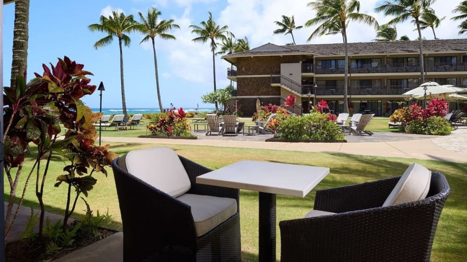 Outdoor lounge seating at Ko'a Kea Resort On Po`ipu Beach.