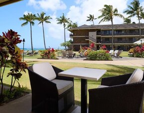 Outdoor lounge seating at Ko'a Kea Resort On Po`ipu Beach.