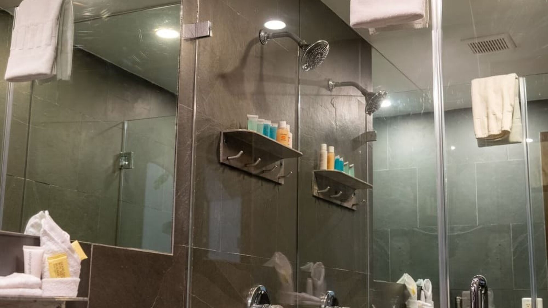 Private guest bathroom with shower and free toiletries at Hotel Chelsea, A South Beach Group Hotel.
