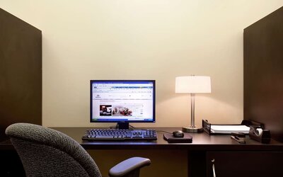 Business center with computer, printer and ergonomic chair at Hilton Orrington/Evanston.