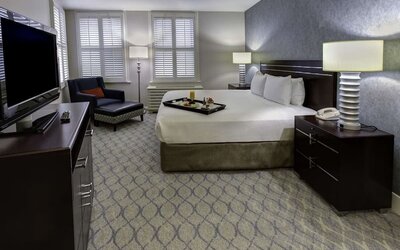 Bright and spacious day use room with work desk and sofa at Hilton Orrington/Evanston.