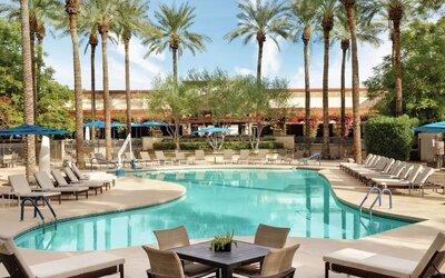 Outdoor pool and lounge chairs at Hilton Scottsdale Resort & Villas.