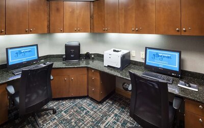 Business center with computers, printer and ergonomic chairs at Hampton Inn Los Angeles-Orange County-Cypress.