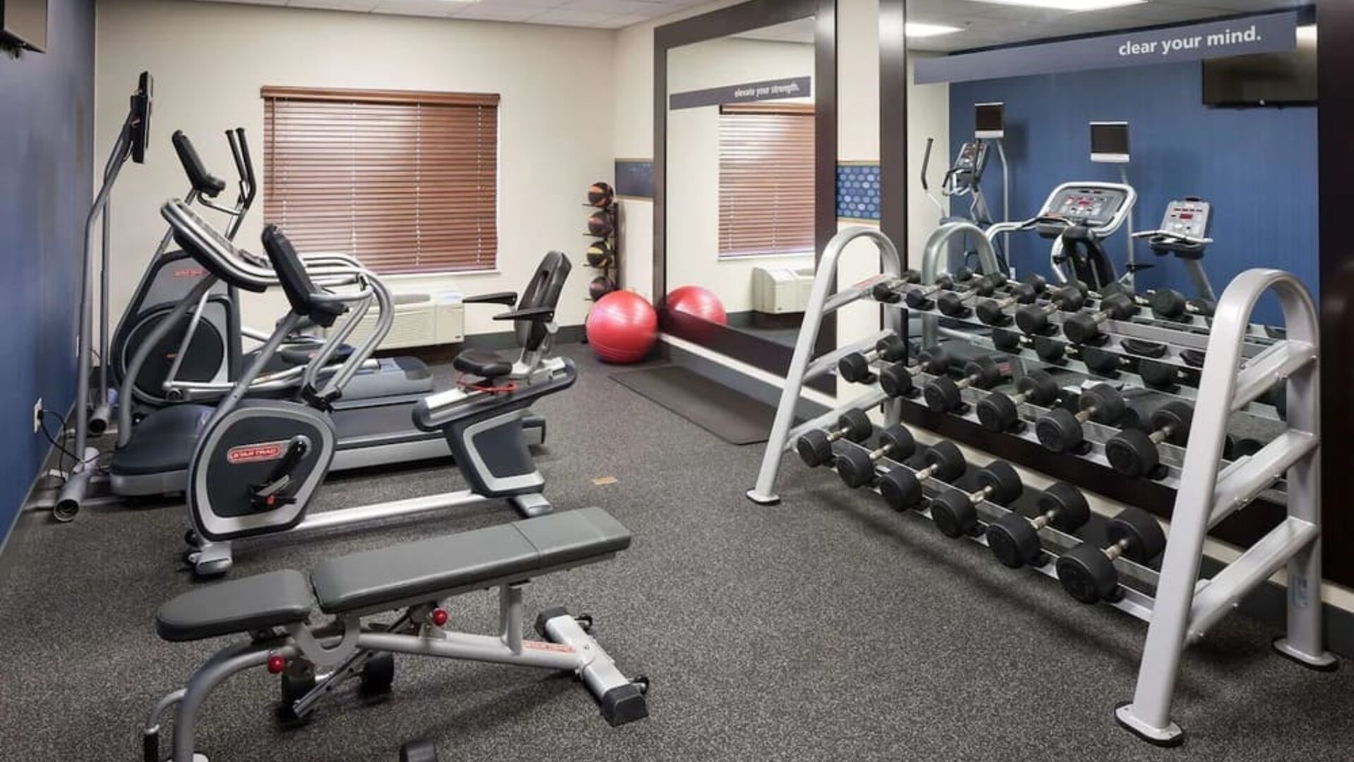 Fully equipped fitness center at Hampton Inn Los Angeles-Orange County-Cypress.