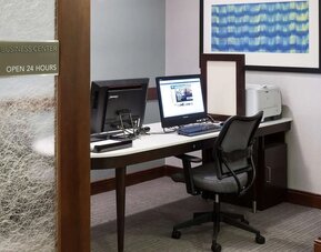 Business center with computers, printer and ergonomic chairs at Homewood Suites By Hilton Agoura Hills.