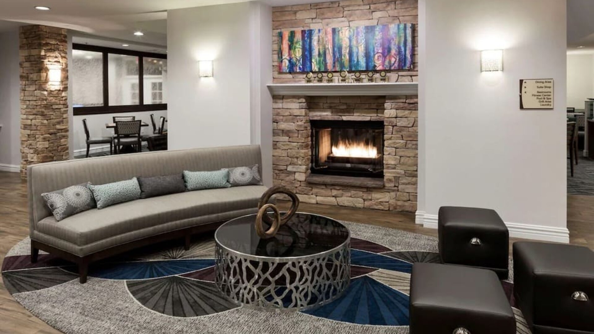 Lobby lounge with fireplace at Homewood Suites By Hilton San Jose Airport-Silicon Valley.