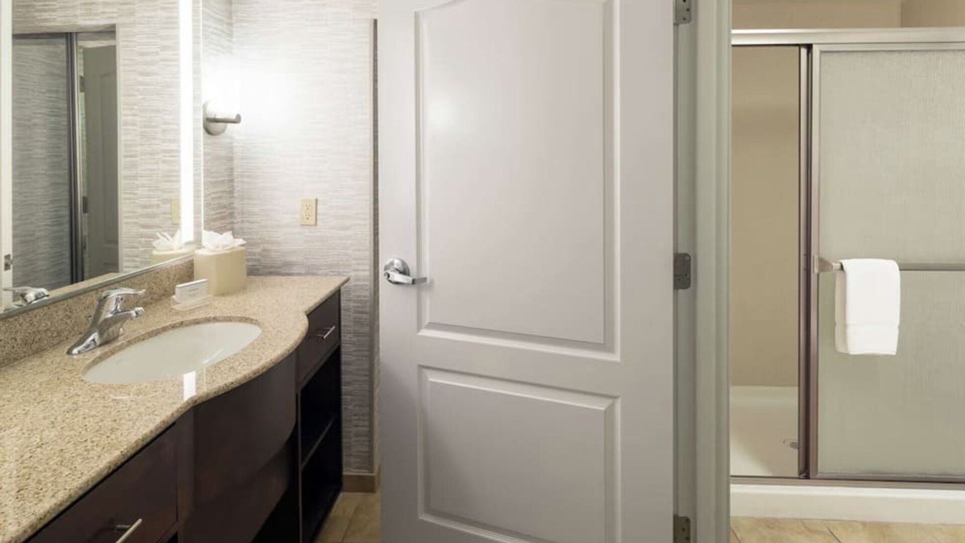 Private guest bathroom with shower and free toiletries at Homewood Suites By Hilton Fresno Airport/Clovis.