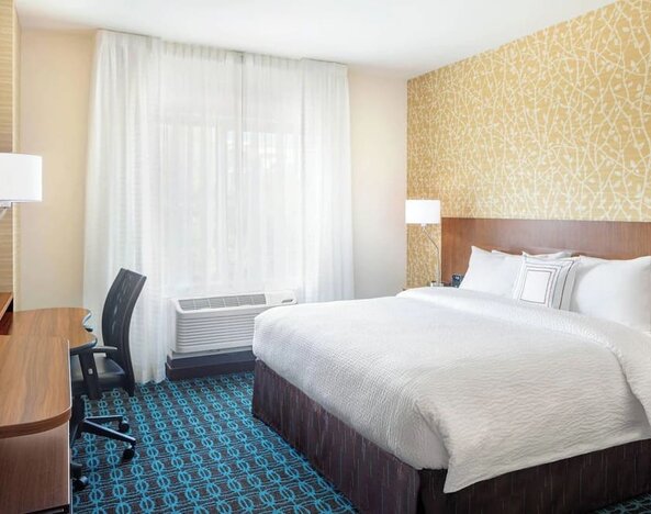 King room with work desk and TV at Fairfield Inn & Suites By Marriott North Bergen.